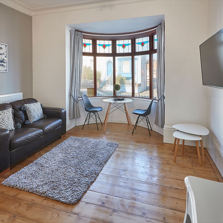 Open plan living area with period fireplace